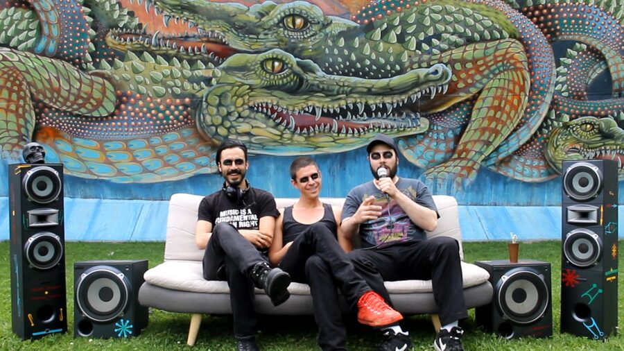 Politan — band portrait at the release, crocodile mural