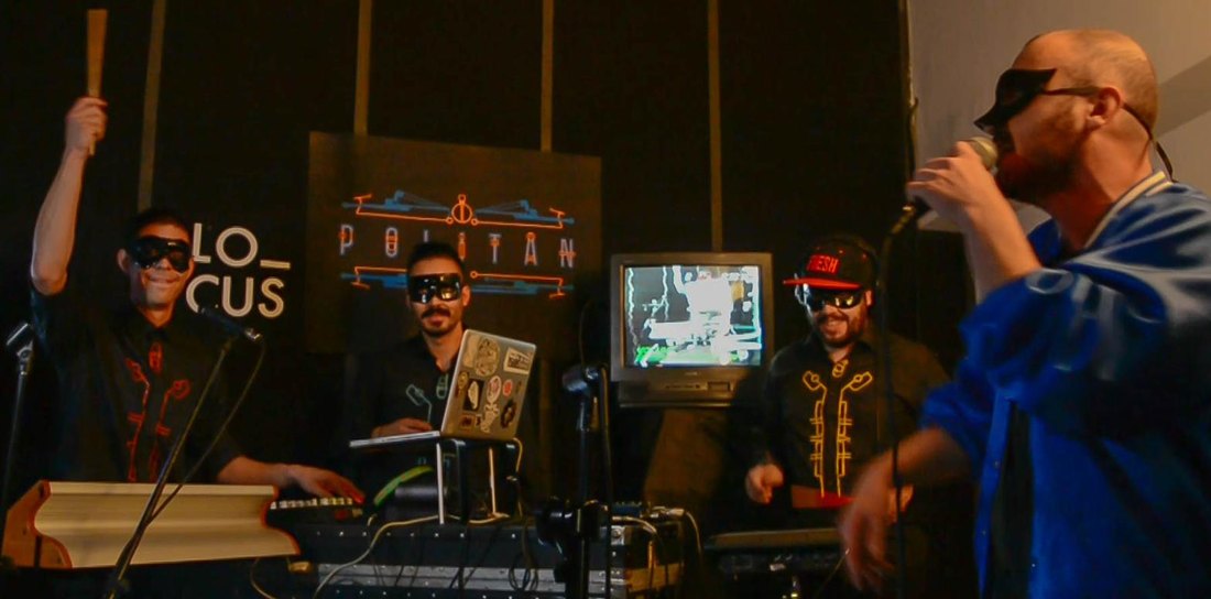 Politan live at LO_CUS — the full band on stage with the neon logo