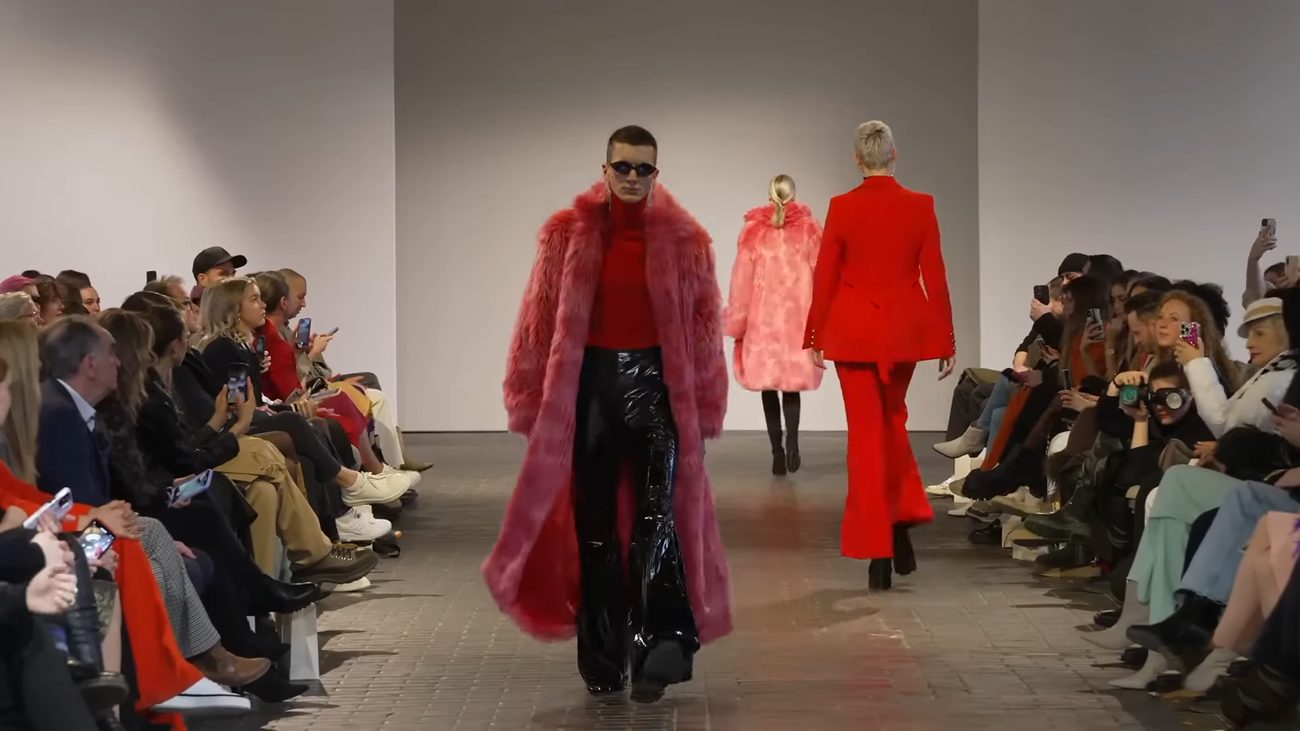 WE.4 runway — model in yellow puffer with braids